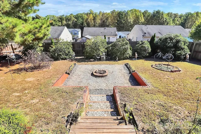 a view of a chairs and table in a patio