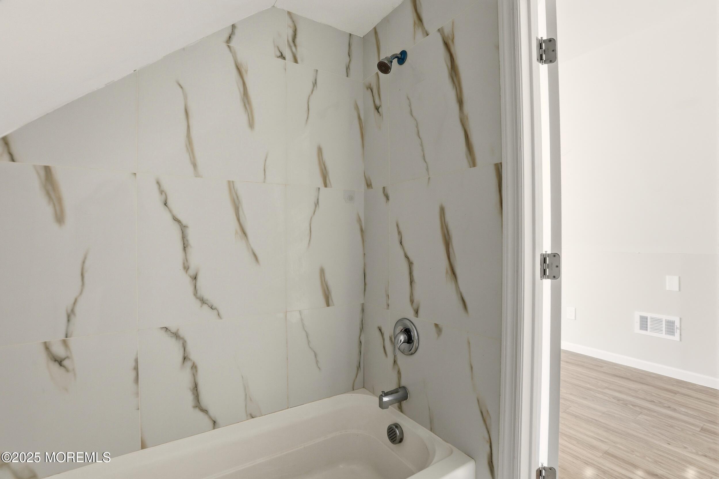 22 Oak Ridge Parkway Toms River, NJ 08755 - Photo 14 of 28 a bathroom with a shower and a bath tub