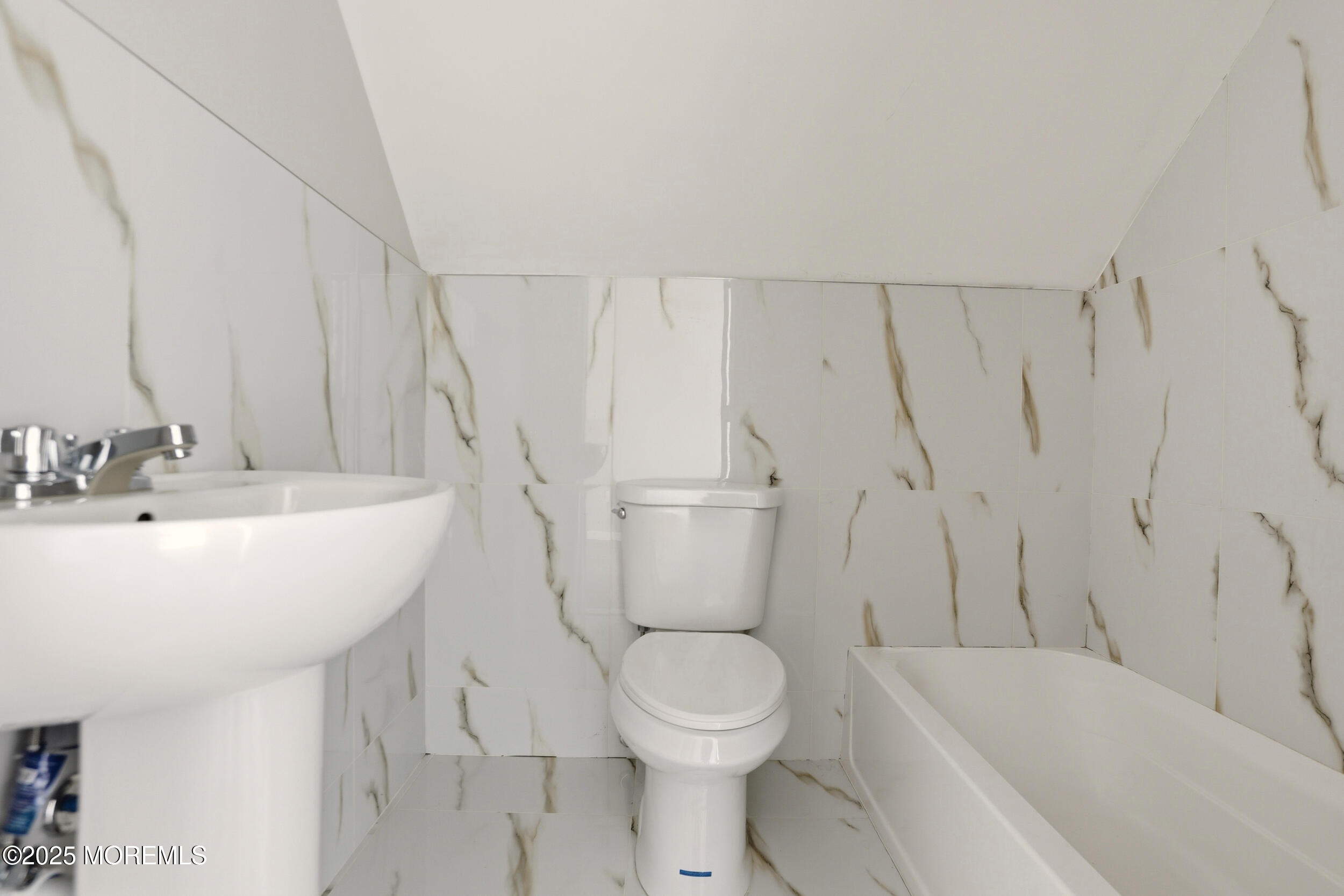 22 Oak Ridge Parkway Toms River, NJ 08755 - Photo 18 of 28 a bathroom with a sink a toilet and a bathtub