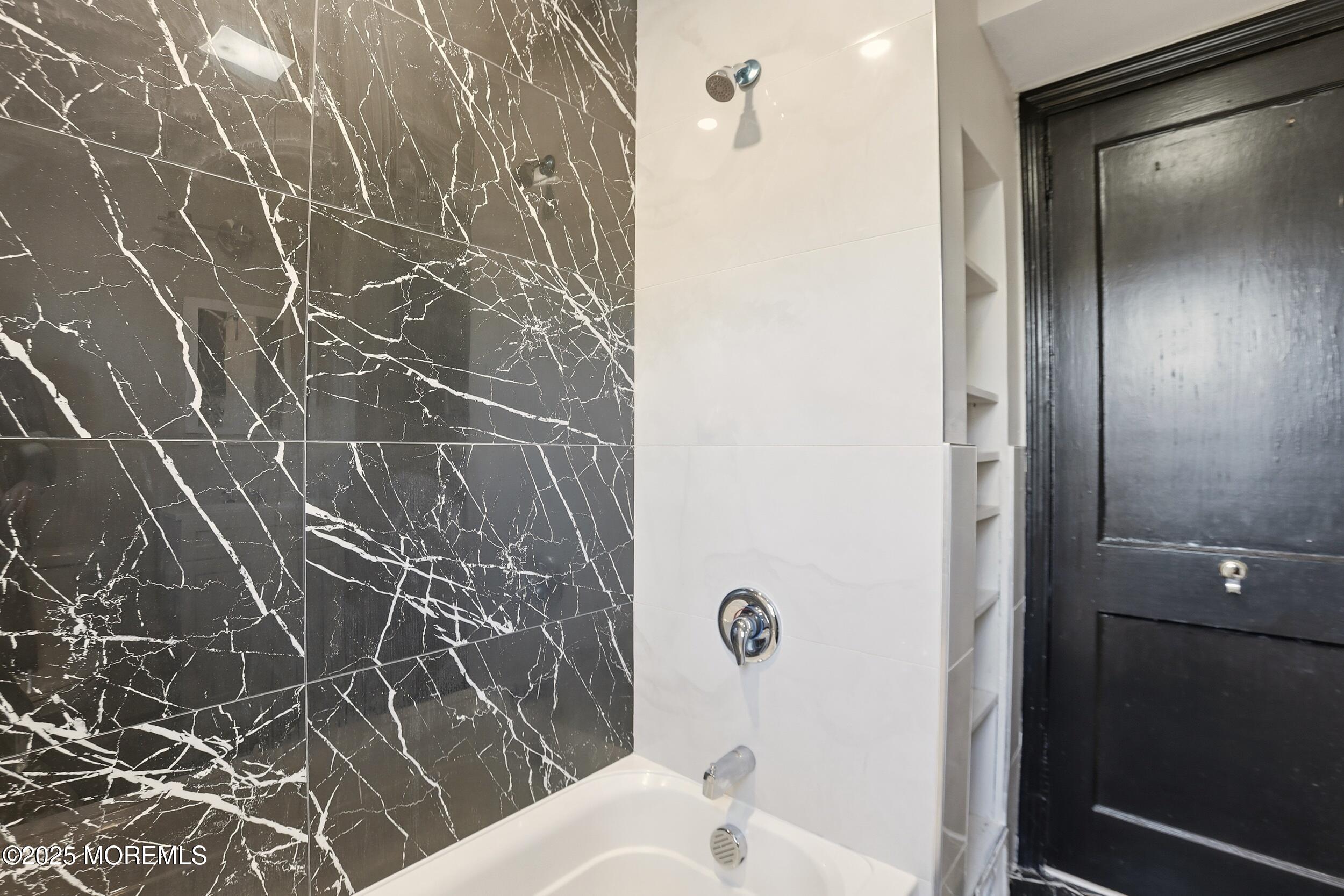 22 Oak Ridge Parkway Toms River, NJ 08755 - Photo 20 of 28 a bathroom with a bathtub and shower