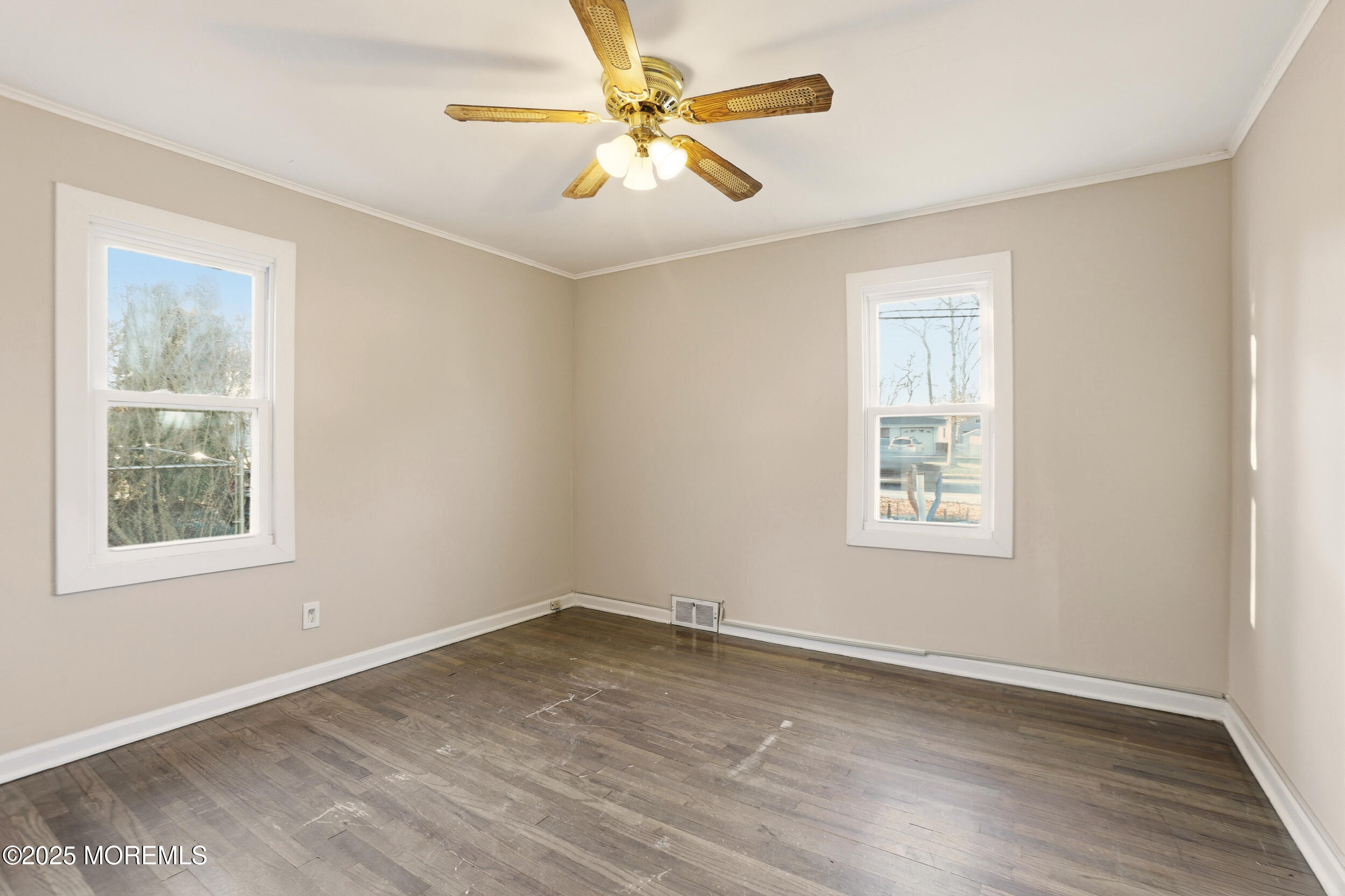 22 Oak Ridge Parkway Toms River, NJ 08755 - Photo 21 of 28 an empty room with a window and a fan