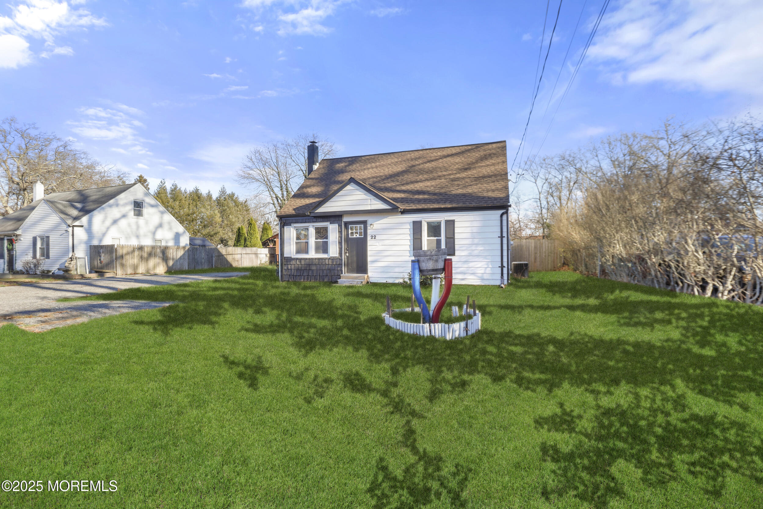 22 Oak Ridge Parkway Toms River, NJ 08755 - Photo 3 of 28 a front view of a house with garden