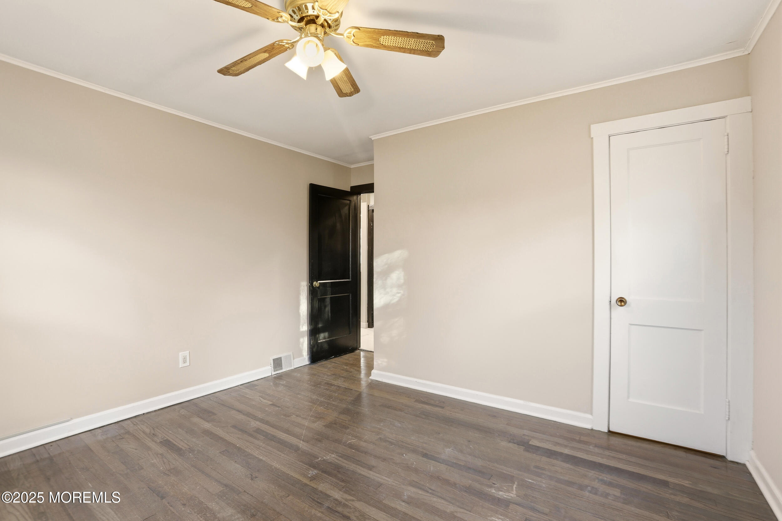22 Oak Ridge Parkway Toms River, NJ 08755 - Photo 6 of 28 a view of an empty room with wooden floor