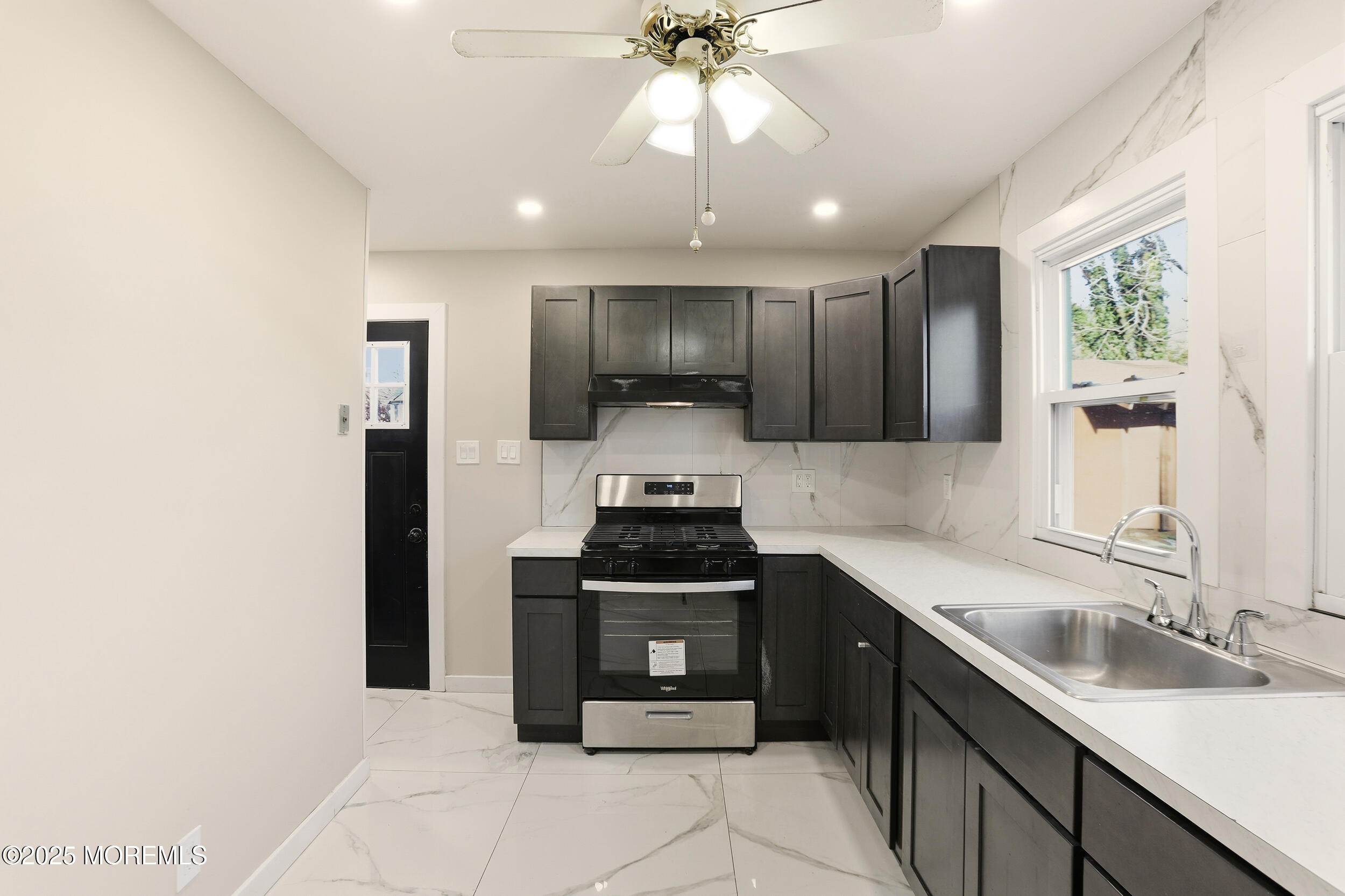 22 Oak Ridge Parkway Toms River, NJ 08755 - Photo 8 of 28 a kitchen with stainless steel appliances granite countertop a sink stove and refrigerator