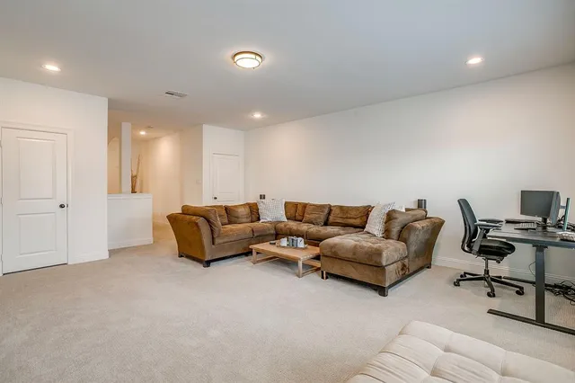 a living room with furniture and a couch