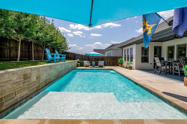 a view of a house with a yard porch and sitting area