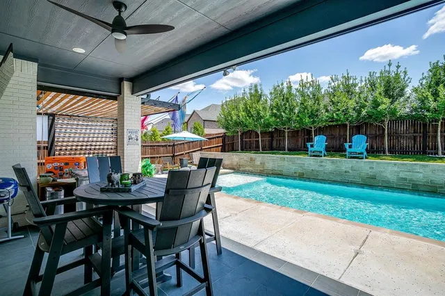 a dining room with furniture and garden view