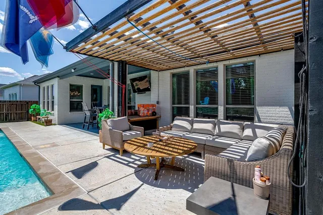 a outdoor space with patio furniture and potted plants