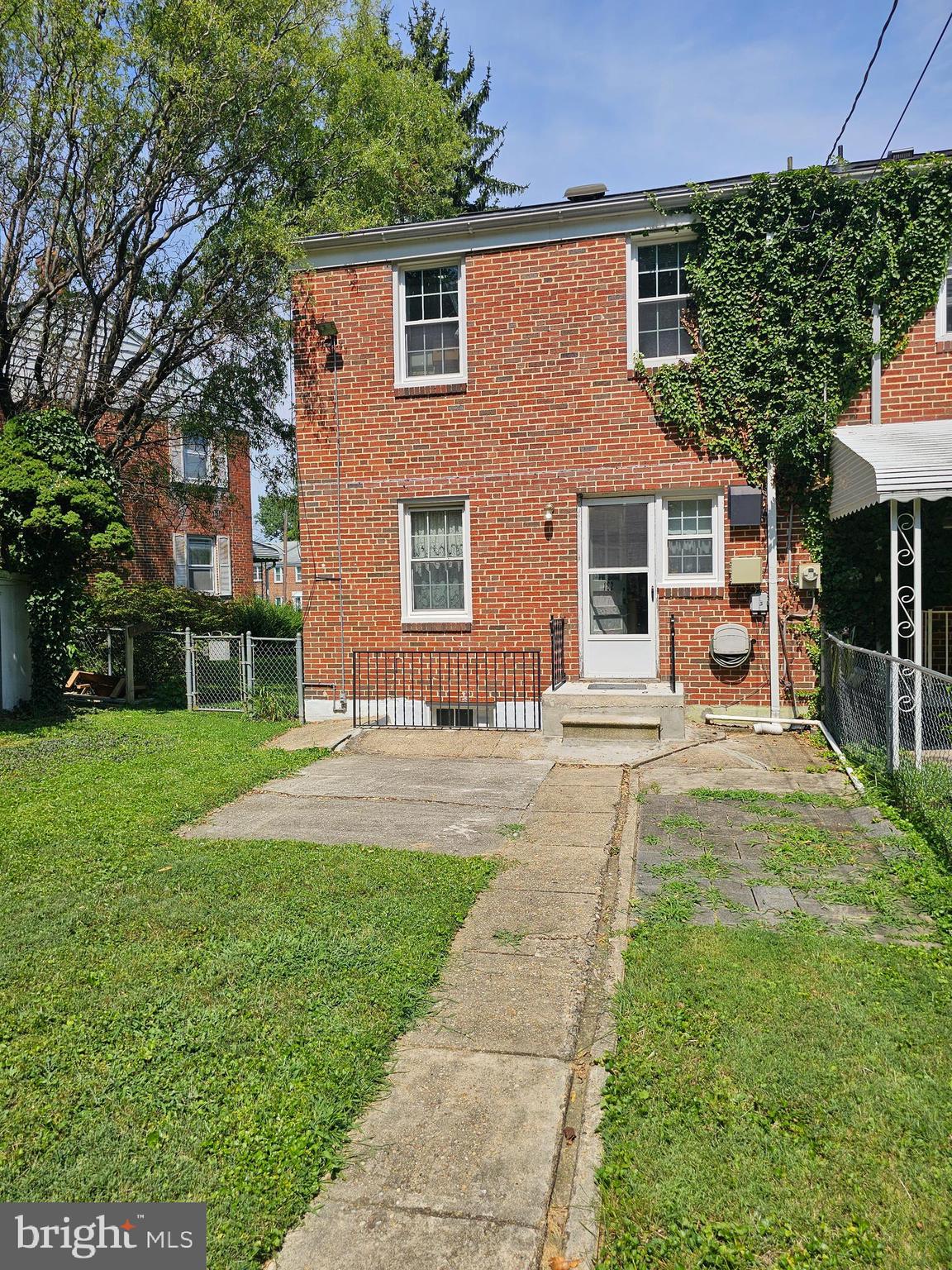 182 Cherrydell Road Baltimore, MD 21228 - Photo 2 of 4 front view of a house with a yard
