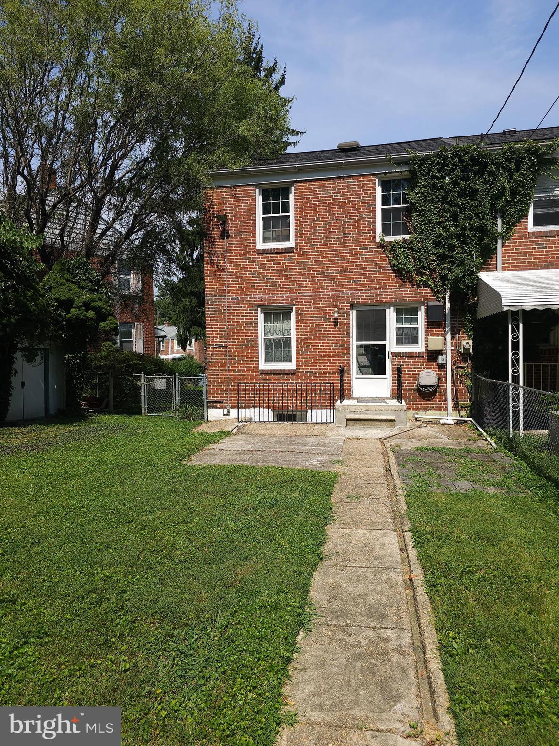 182 Cherrydell Road Baltimore, MD 21228 - Photo 3 of 4 a front view of a house with a yard