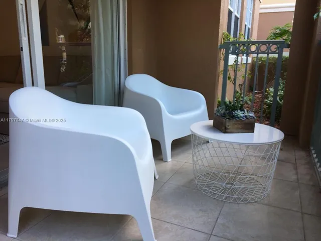 a outdoor dining space with furniture