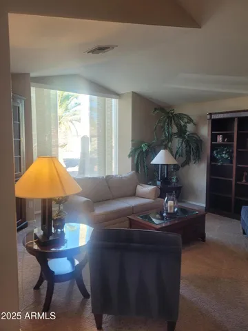 a living room with furniture and a table