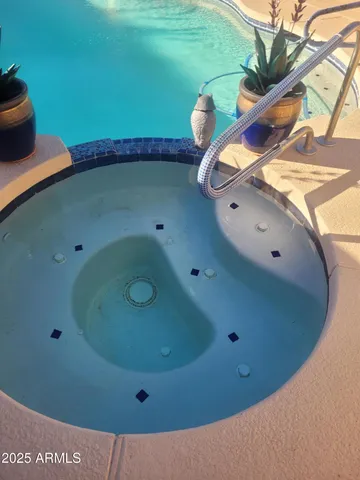 a bedroom with a bed and a potted plant