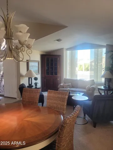 a living room with furniture a fireplace and a table