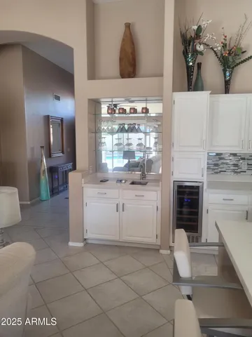 a stove top oven sitting inside of a kitchen