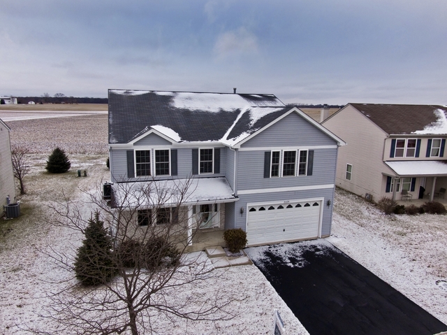 2224 Ridge Drive Hebron, IL 60034 - Photo 1 of 29 a front view of a house with windows