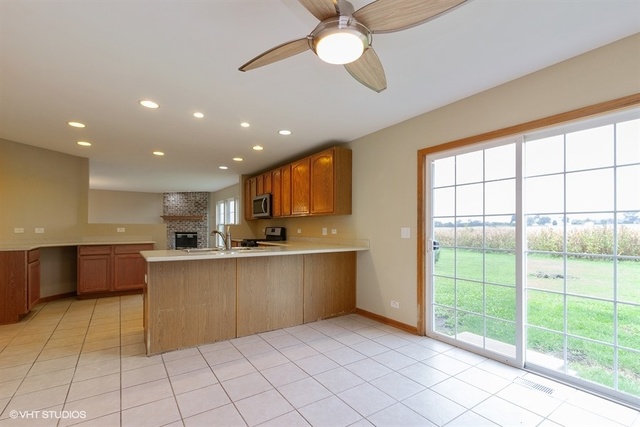 2224 Ridge Drive Hebron, IL 60034 - Photo 13 of 29 a large kitchen with kitchen island a large window in it