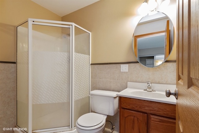 2224 Ridge Drive Hebron, IL 60034 - Photo 20 of 29 a bathroom with a granite countertop sink toilet and shower