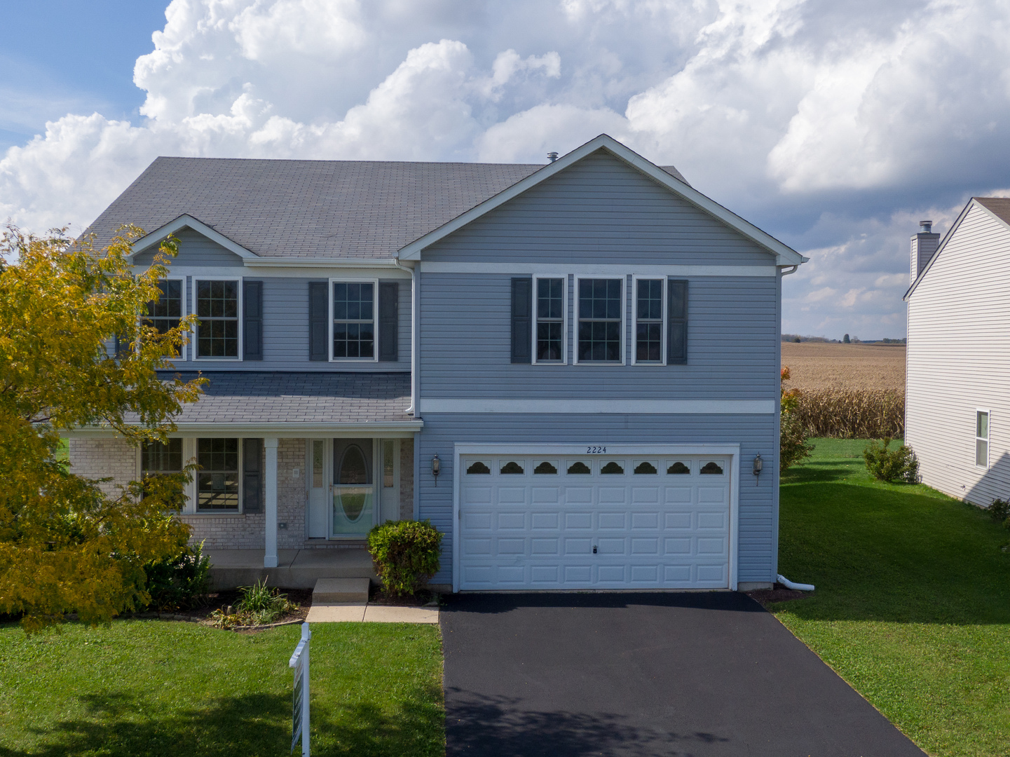2224 Ridge Drive Hebron, IL 60034 - Photo 3 of 29 a front view of a house with a yard