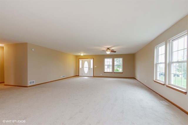 2224 Ridge Drive Hebron, IL 60034 - Photo 7 of 29 an empty room with windows