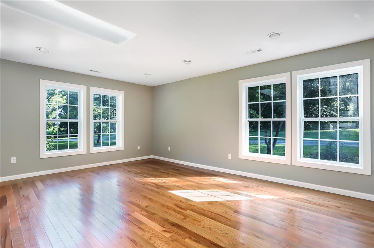 178 Outpost Road Luray, VA 22835 - Photo 8 of 14 a view of an empty room with a window and wooden floor
