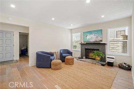 19849 Crystal Ridge Lane Porter Ranch, CA 91326 - Photo 11 of 29 a living room with furniture and a fireplace