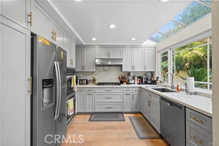 19849 Crystal Ridge Lane Porter Ranch, CA 91326 - Photo 12 of 29 a kitchen with a sink stainless steel appliances and window