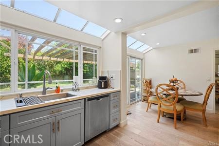 19849 Crystal Ridge Lane Porter Ranch, CA 91326 - Photo 14 of 29 a kitchen with a sink and chairs
