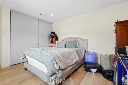 19849 Crystal Ridge Lane Porter Ranch, CA 91326 - Photo 20 of 29 a bedroom with a bed and a flat tv screen on the dresser