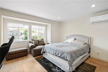 19849 Crystal Ridge Lane Porter Ranch, CA 91326 - Photo 21 of 29 a bedroom with a bed couch and a large window