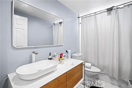 19849 Crystal Ridge Lane Porter Ranch, CA 91326 - Photo 25 of 29 a bathroom with a white toilet a sink and a mirror