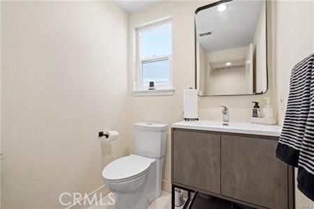 19849 Crystal Ridge Lane Porter Ranch, CA 91326 - Photo 26 of 29 a bathroom with a sink toilet and mirror