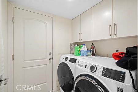 19849 Crystal Ridge Lane Porter Ranch, CA 91326 - Photo 27 of 29 a utility room with dryer and washer
