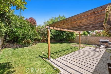 19849 Crystal Ridge Lane Porter Ranch, CA 91326 - Photo 28 of 29 a view of a backyard and floor to ceiling window