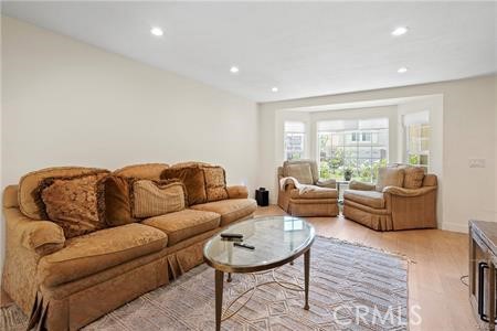 19849 Crystal Ridge Lane Porter Ranch, CA 91326 - Photo 4 of 29 a living room with furniture and a large window