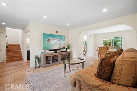 19849 Crystal Ridge Lane Porter Ranch, CA 91326 - Photo 5 of 29 a living room with furniture and a flat screen tv