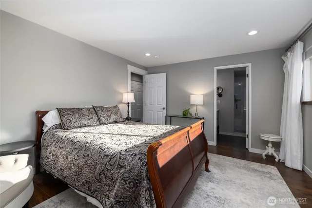 a bed room with a bed and a lamp