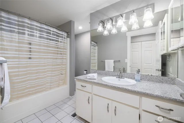 a bathroom with a sink a vanity and a mirror