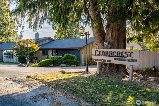 a view of a house with swimming pool and sitting area