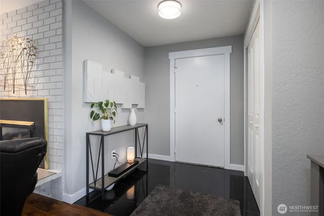 a view of an entryway with wooden floor