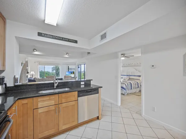 a kitchen with stainless steel appliances a sink and cabinets