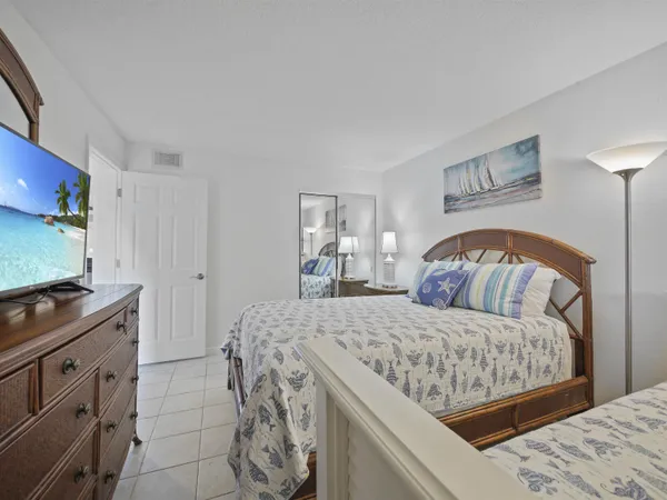 a bedroom with a bed and a dresser
