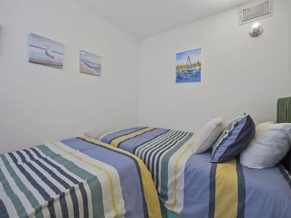 a bed sitting in a bedroom next to a small yard