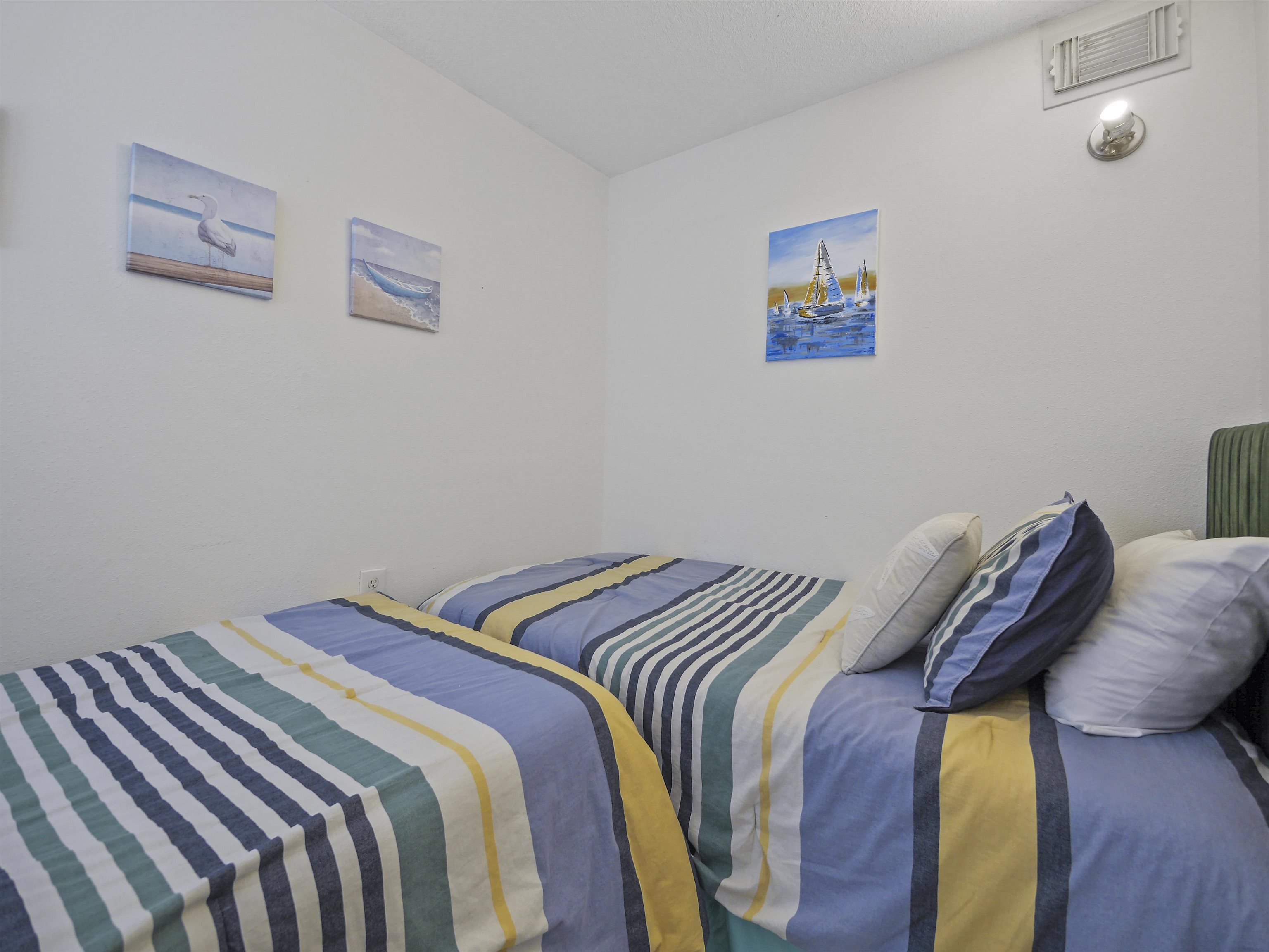 4670 A1A South St. Augustine, FL 32080 - Photo 23 of 32 a bed sitting in a bedroom next to a small yard