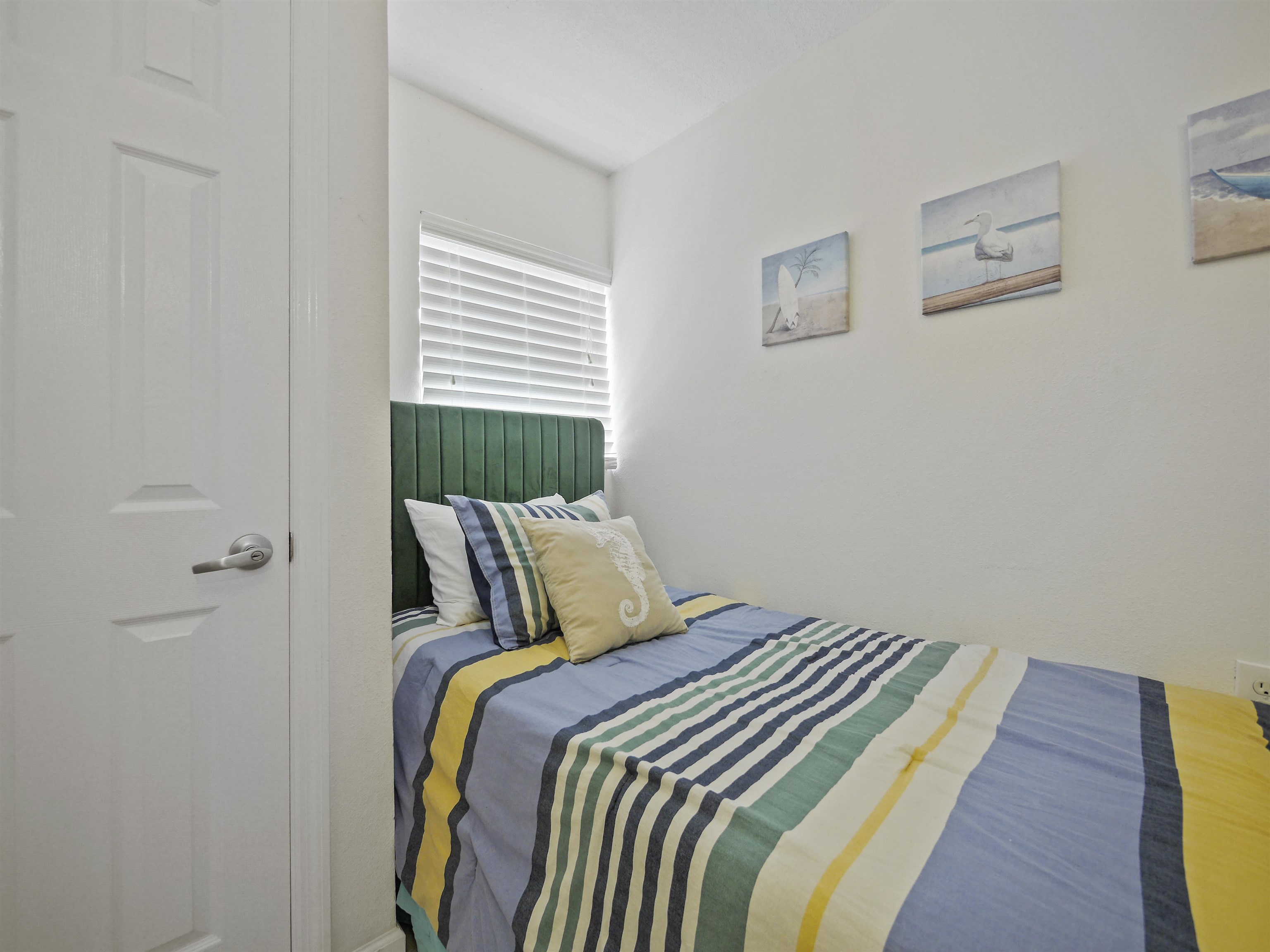 4670 A1A South St. Augustine, FL 32080 - Photo 24 of 32 a bedroom with a bed and wooden floor