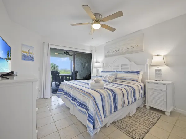 a bedroom with a bed and a mirror