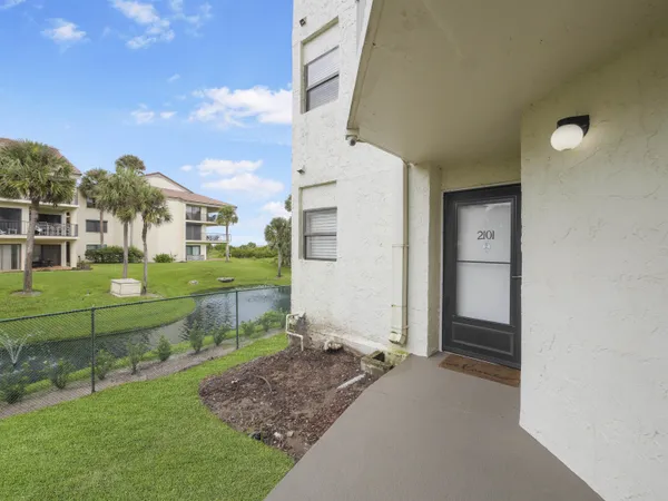 a view of an house with backyard space and garden