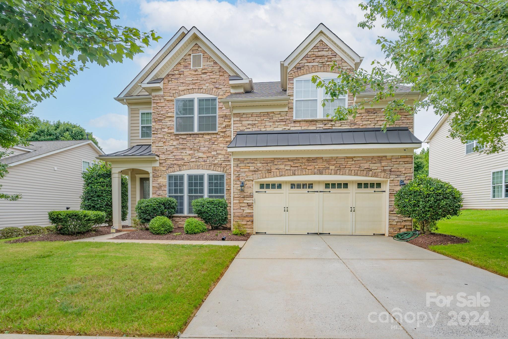 925 Treasure Court Fort Mill, SC 29708 - Photo 1 of 45 a view of a house with a yard and potted plants