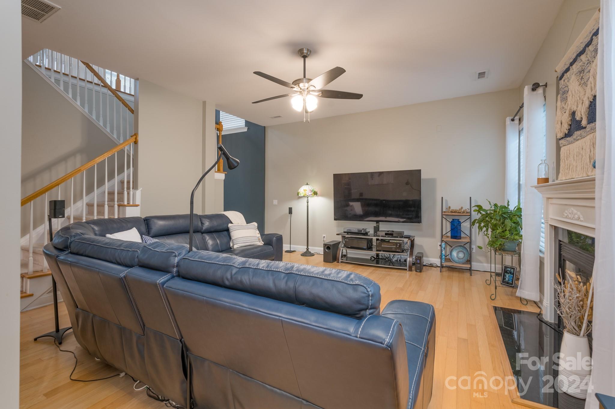 925 Treasure Court Fort Mill, SC 29708 - Photo 12 of 45 a living room with furniture and a flat screen tv
