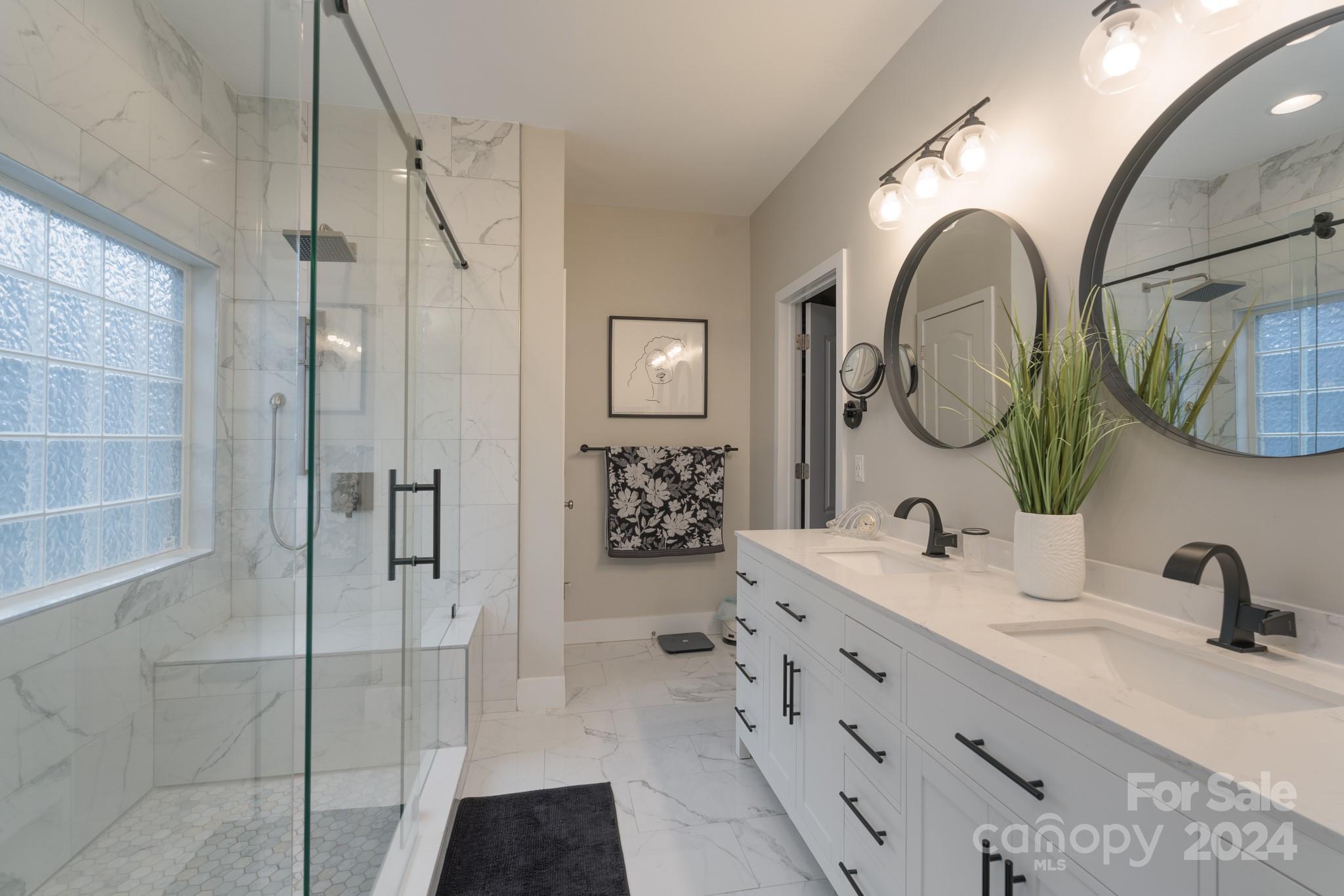 925 Treasure Court Fort Mill, SC 29708 - Photo 2 of 45 a bathroom with a double vanity sink mirror and shower